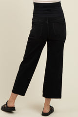 woman wearing black maternity wide leg jeans with a high waistband, viewed from the back