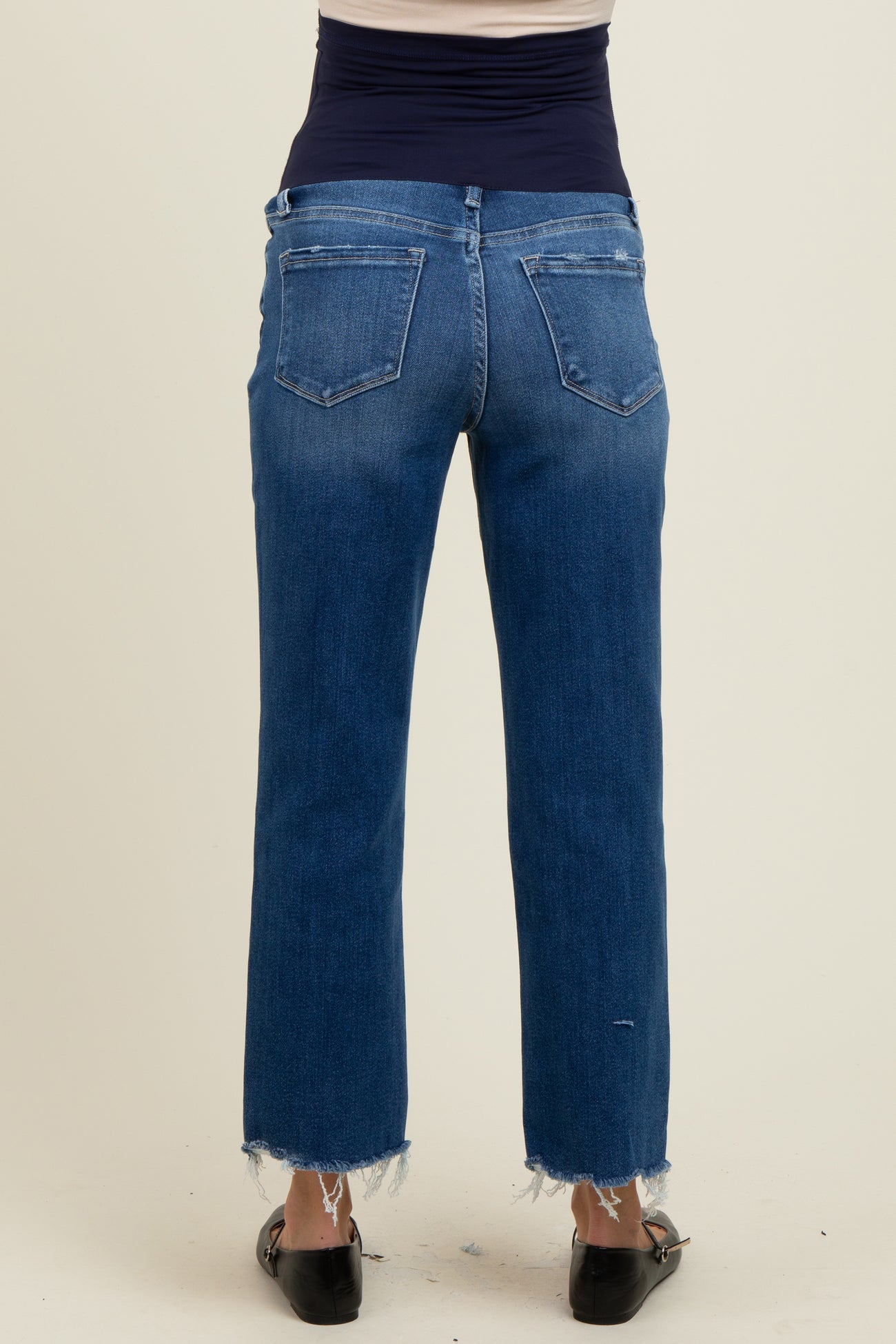 maternity wear dark wash straight leg jeans with frayed hem, model showing the back view