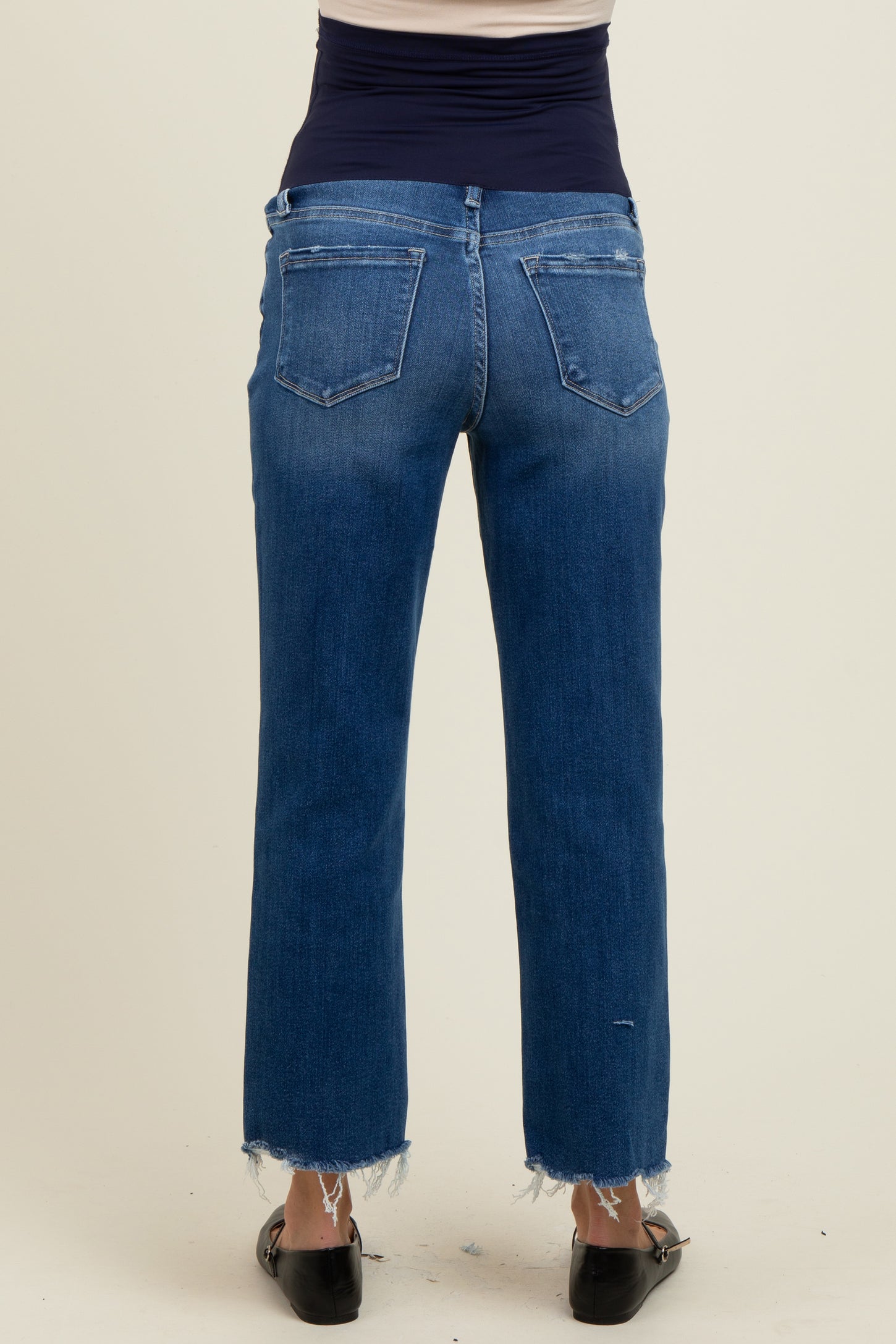 maternity wear dark wash straight leg jeans with frayed hem, model showing the back view