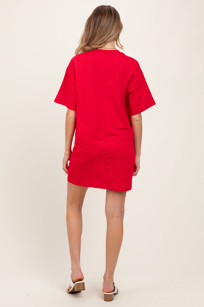 woman wearing a red short sleeve maternity dress, shown from the back