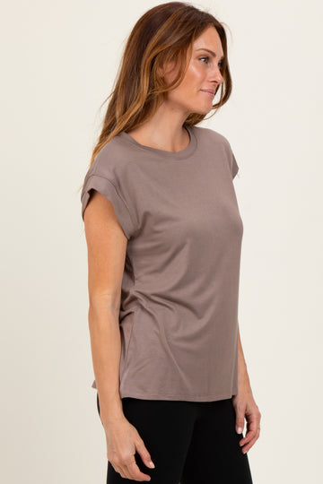 woman wearing a brown short sleeve casual t-shirt with rolled sleeves and a relaxed fit