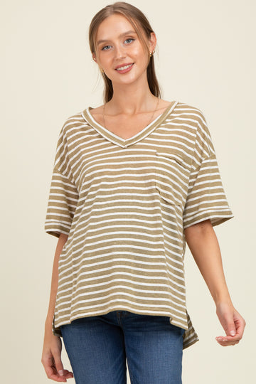 woman wearing a striped maternity top in olive green and white with a v-neck and side slits, smiling at the camera