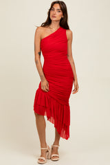 woman wearing a red one-shoulder ruched dress with a ruffled hem and a fitted silhouette