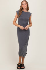woman wearing a gray cap sleeve midi dress and black sandals