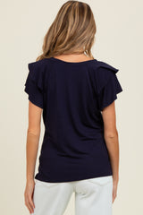woman wearing a navy blue maternity top with ruffled short sleeves, viewed from the back