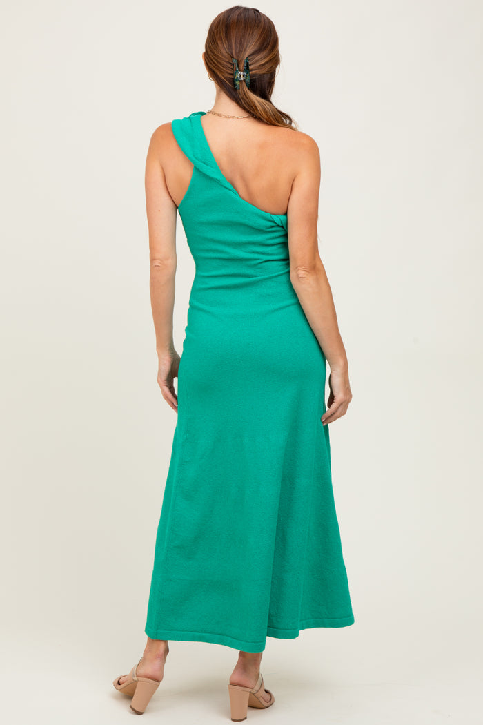 woman wearing a green one-shoulder maxi dress, showing the back view