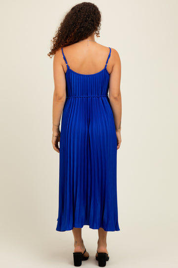 woman wearing a blue pleated maternity maxi dress, showing the back and a relaxed fit