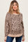 woman wearing a lightweight beige leopard print maternity sweater with long sleeves and a relaxed fit