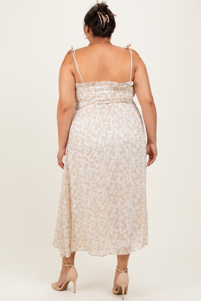 woman wearing a light floral plus-size midi dress with adjustable straps and a smocked bodice, viewed from the back
