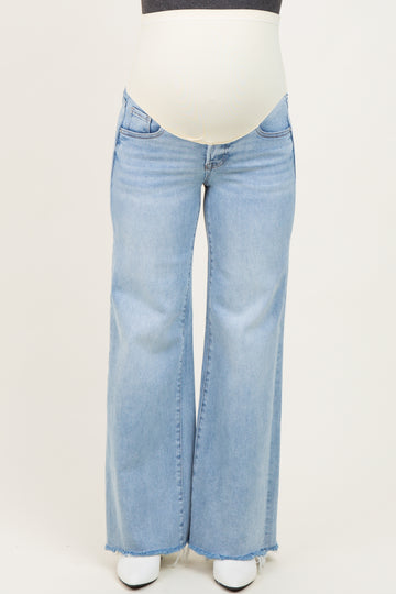 maternity wear light blue flared jeans with a stretchy waistband and visible baby bump