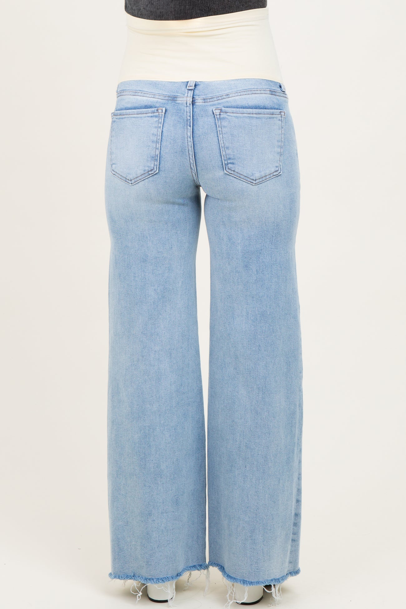 light blue maternity wide-leg jeans with a fitted waistband, shown from the back