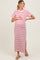 woman wearing a white and red striped maternity maxi dress with short sleeves and a side slit, holding her baby bump