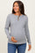 woman wearing a gray ribbed maternity top and holding her baby bump