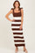 woman wearing a brown and white striped knit maxi dress with square neckline and bow shoulder straps