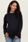 woman wearing a black long sleeve maternity top and showcasing her baby bump