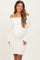 woman wearing a cream off-the-shoulder maternity dress with a fitted silhouette and long sleeves, showing her baby bump