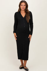 woman wearing a black long sleeve maternity dress with a v-neck and button-down front, showcasing her baby bump