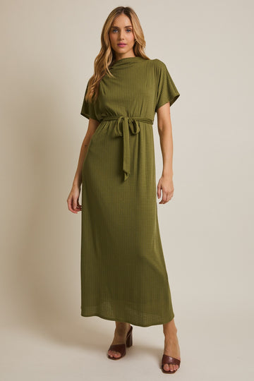woman wearing an olive green short sleeve maxi dress with a belt and a ribbed texture