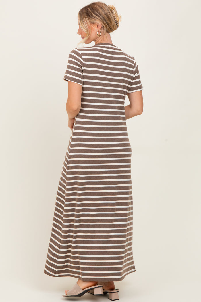 woman wearing a brown and white striped maxi dress with short sleeves, viewed from the back