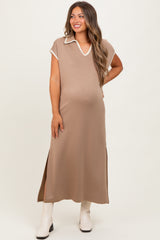 woman wearing a taupe maternity maxi dress with a v-neck and side slits, showing her baby bump