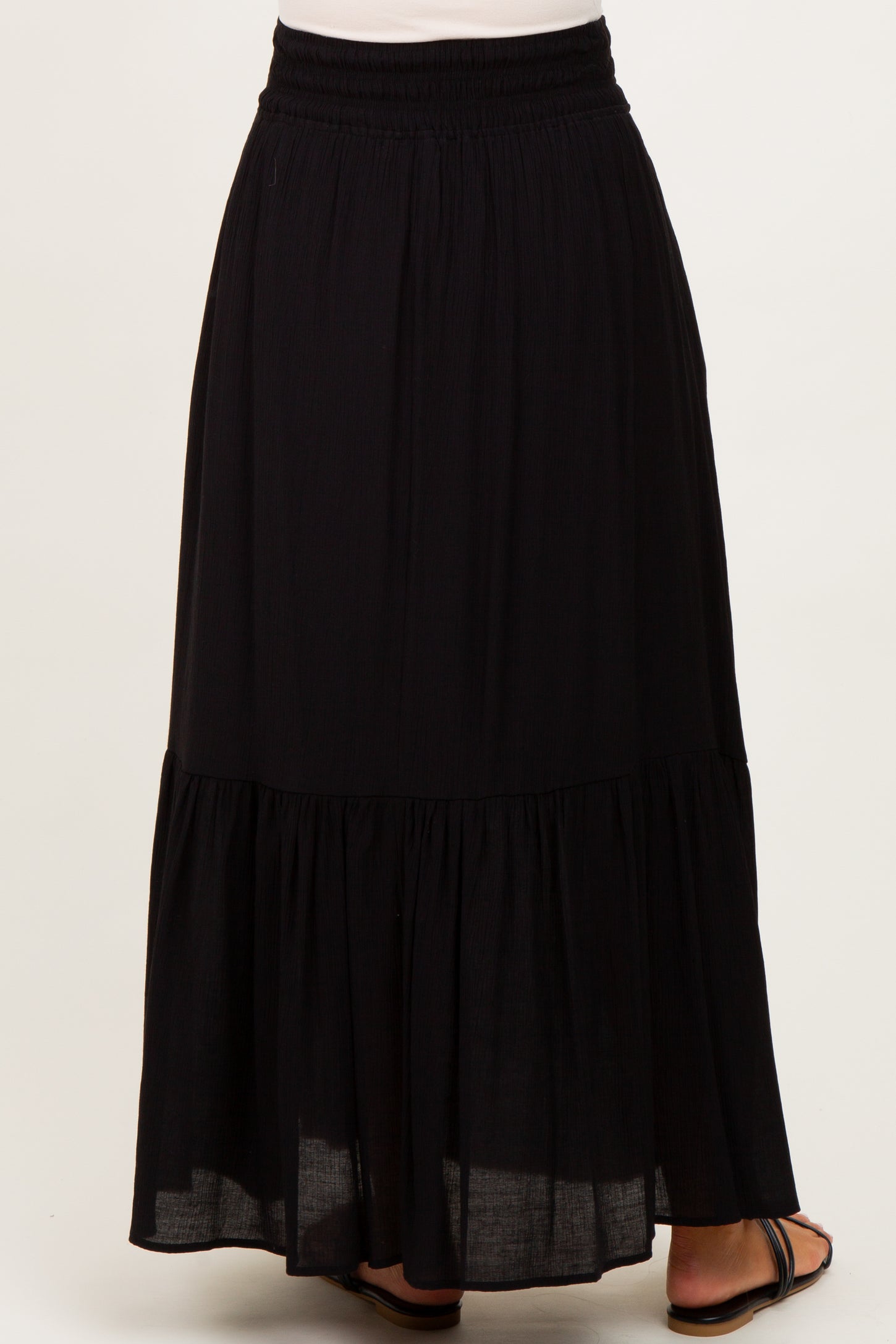 maternity wear black tiered maxi skirt with an elastic waistband, view of the back side