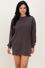 woman wearing a charcoal gray long sleeve oversized sweatshirt dress