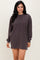 woman wearing a charcoal gray long sleeve oversized sweatshirt dress