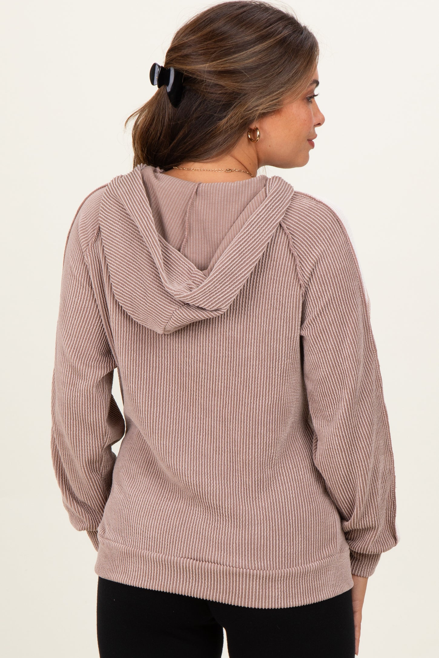 woman wearing a brown ribbed hooded maternity sweatshirt, shown from the back with a loose fit and long sleeves