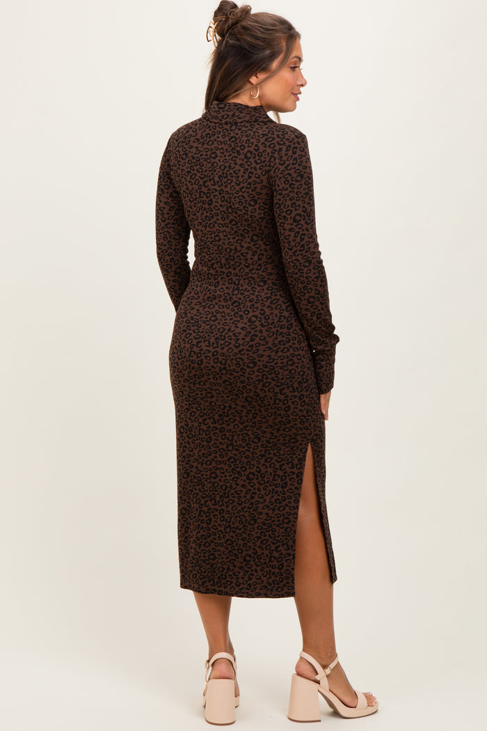 woman wearing a brown leopard print long sleeve maternity dress with a side slit, showing her baby bump from behind
