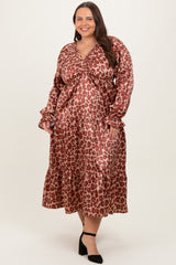 woman wearing a red and brown leopard print maxi dress with a ruched bodice and ruffled sleeves