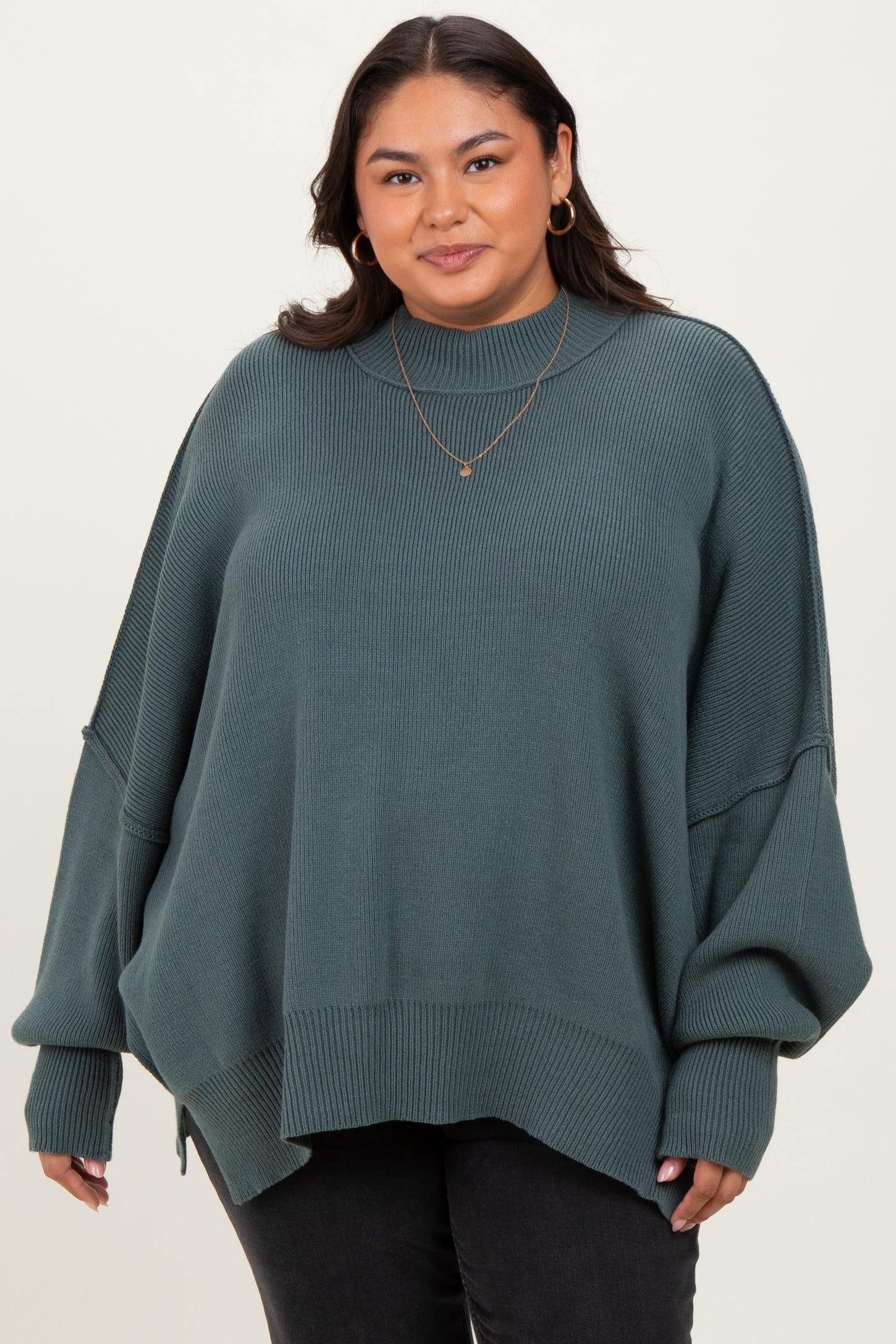 Jade Mock Neck Exposed Seam Sweater