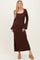 woman wearing a brown long sleeve ribbed maxi dress with a square neckline and flared sleeves