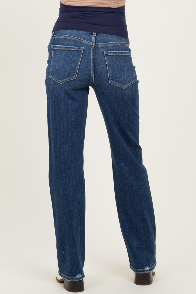 woman wearing dark wash maternity jeans with a stretchy waistband, viewed from the back