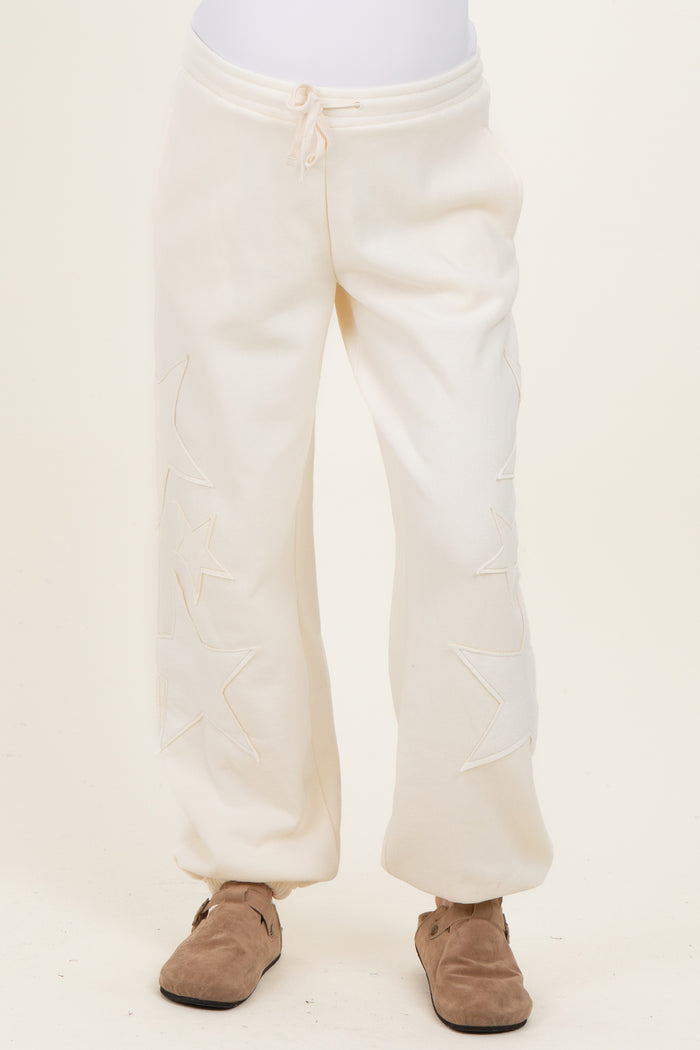 maternity wear cream jogger pants with star embroidery and drawstring waist
