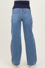 maternity wear light blue wide-leg jeans with a dark blue stretchy waistband, shown from the back