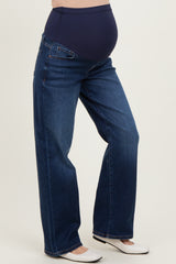 woman wearing dark blue maternity jeans with a high waistband and a visible baby bump