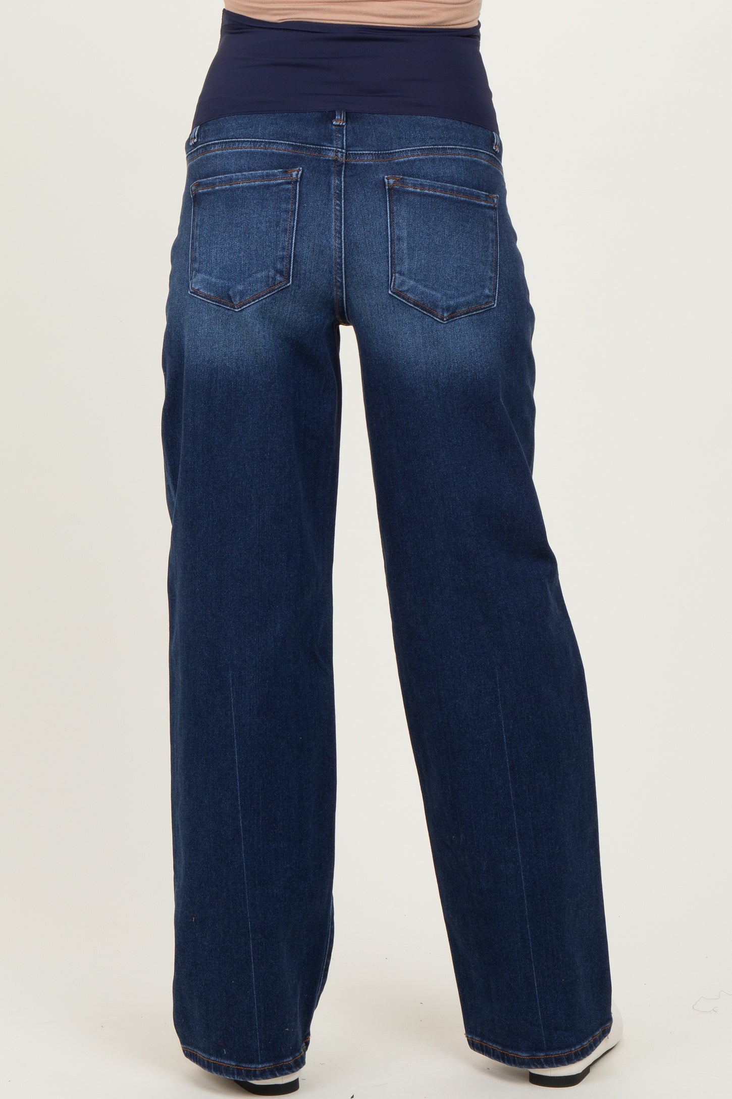 maternity wear dark blue wide-leg jeans with a supportive belly panel, viewed from the back