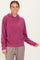 woman wearing a rose pink casual hoodie with a front pocket and relaxed fit