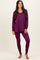 woman wearing a long sleeve v-neck purple top and matching purple leggings