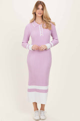 woman wearing a purple ribbed long sleeve polo dress with white accents and button placket