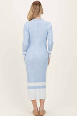 woman wearing a light blue ribbed midi dress with long sleeves and white stripe accents