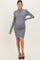 woman wearing a gray ribbed maternity dress that hugs her baby bump and features long sleeves