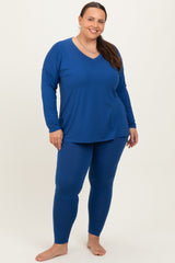 woman wearing a blue long sleeve top and matching leggings in plus size activewear