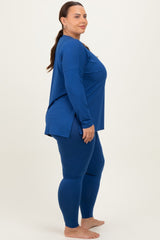 woman wearing a blue long sleeve top and matching leggings in a plus size fit