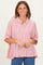 woman wearing a red and white striped button-up shirt with a relaxed fit and oversized sleeves