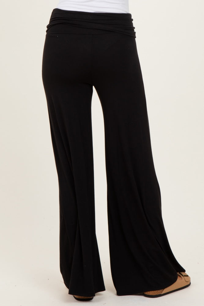 black wide-leg trousers with a high waistband shown from the back