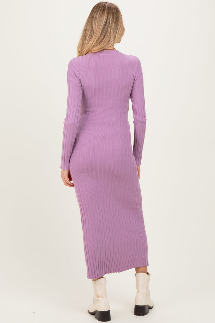 woman wearing a long sleeve lavender ribbed maternity dress, showing a fitted silhouette from the back