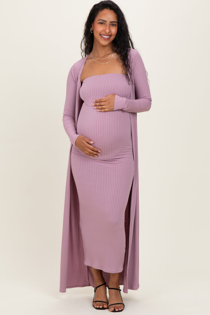 woman wearing a lavender ribbed maternity dress with a long cardigan and a visible baby bump