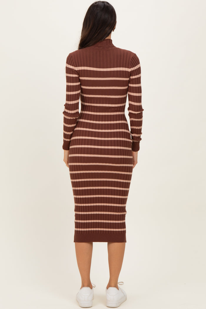 woman wearing a brown and beige striped midi dress with a high neck and long sleeves, viewed from the back
