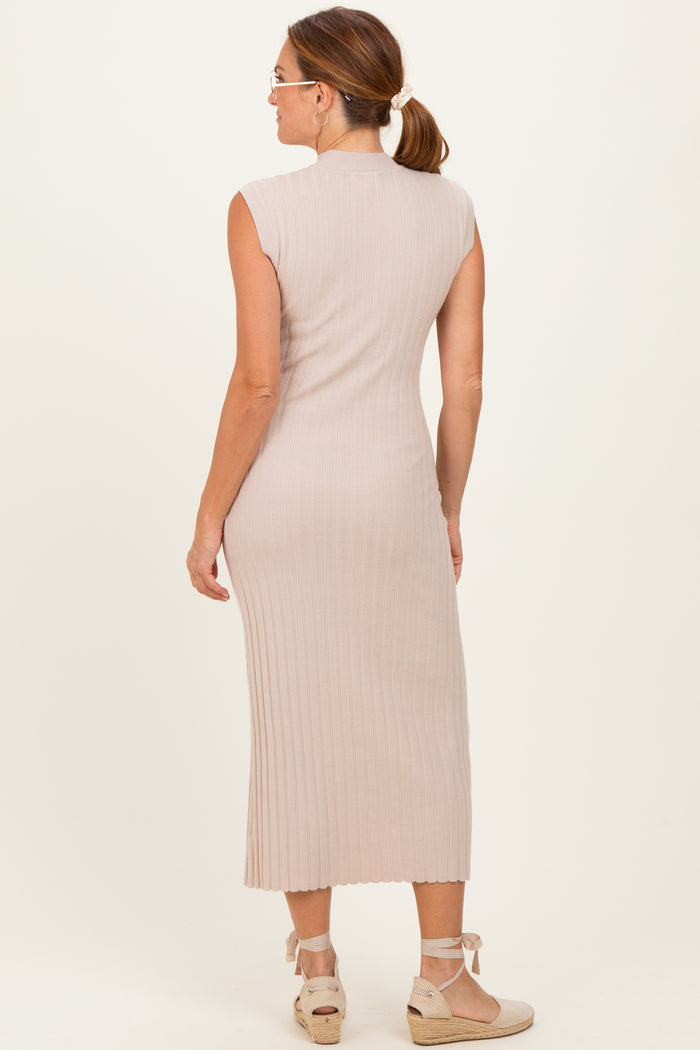 woman wearing a light beige ribbed sleeveless midi dress, shown from the back with a fitted silhouette
